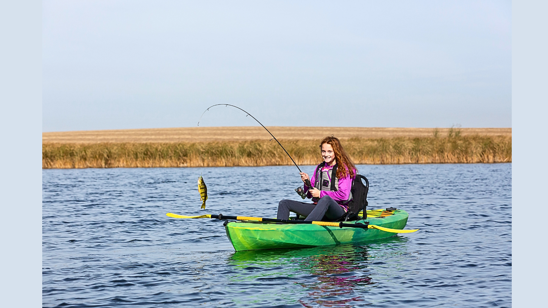 A girl enjoing Fishing on her Kayak