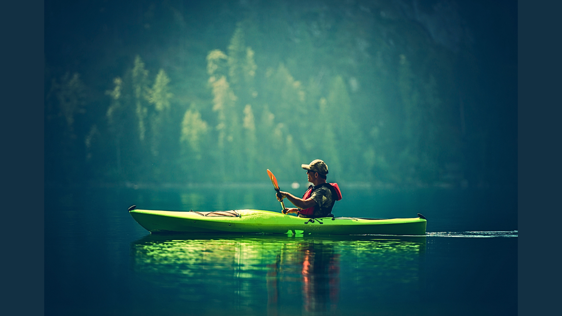 a men enjoing Touring in his green color Kayak
